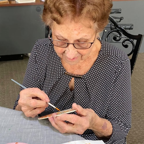 A resident painting at Canoe Brook Assisted Living in Ardmore, Oklahoma