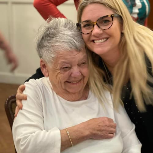 A team member interacting with a resident at Oxford Glen Memory Care at Owasso in Owasso, Oklahoma