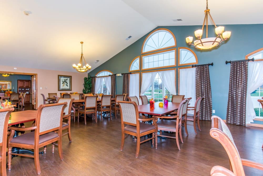 Elegant dining room complete with chandeliers at Brookstone Estates of Rantoul in Rantoul, Illinois