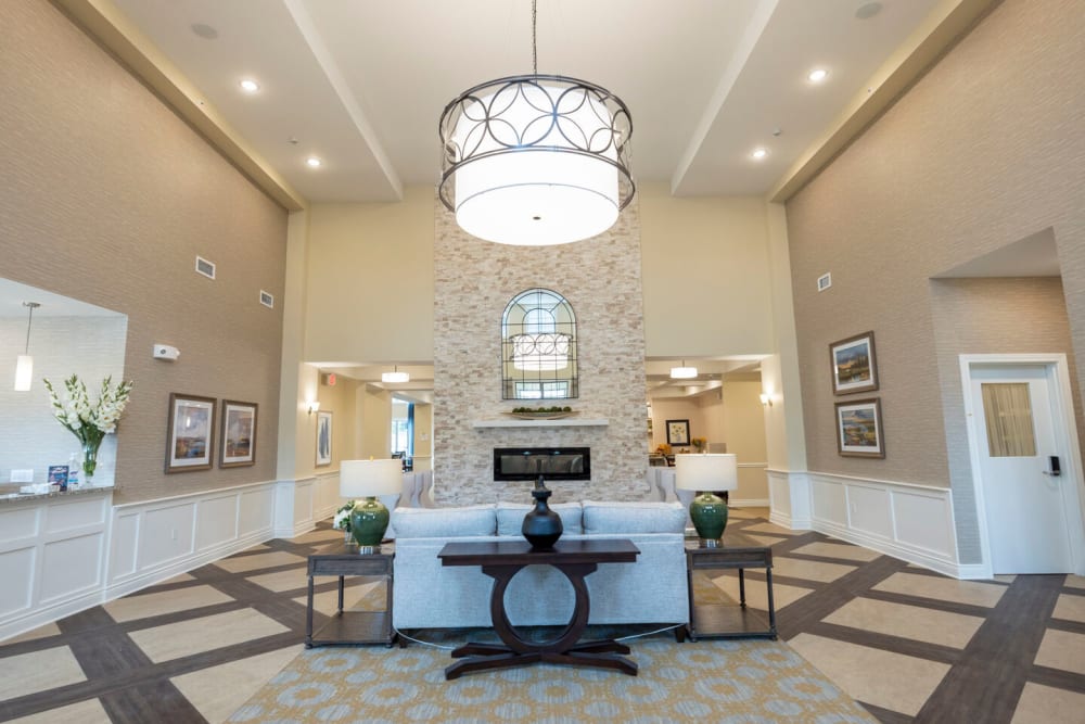 Common area with tall ceilings at The Wellington Senior Living in Liberty, Missouri