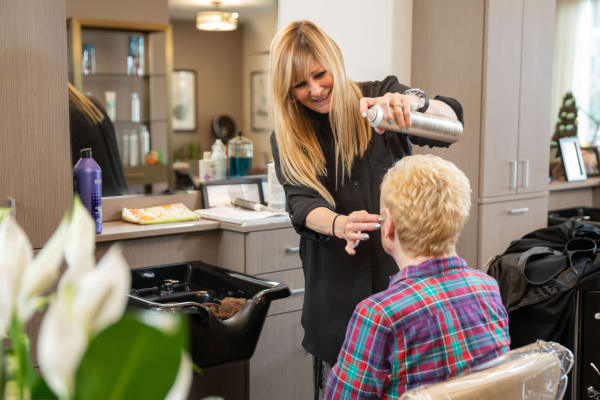 Resident getting their hair done at Touchmark at Emerald Lake in McKinney, Texas