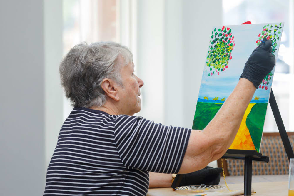 Resident painting at Touchmark at Fairway Village in Vancouver, Washington