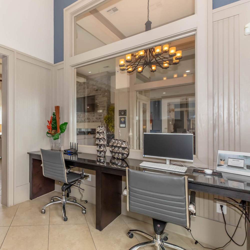 Stylish office with workstations and modern decor at Aria Victoria Apartments in Victoria, Texas