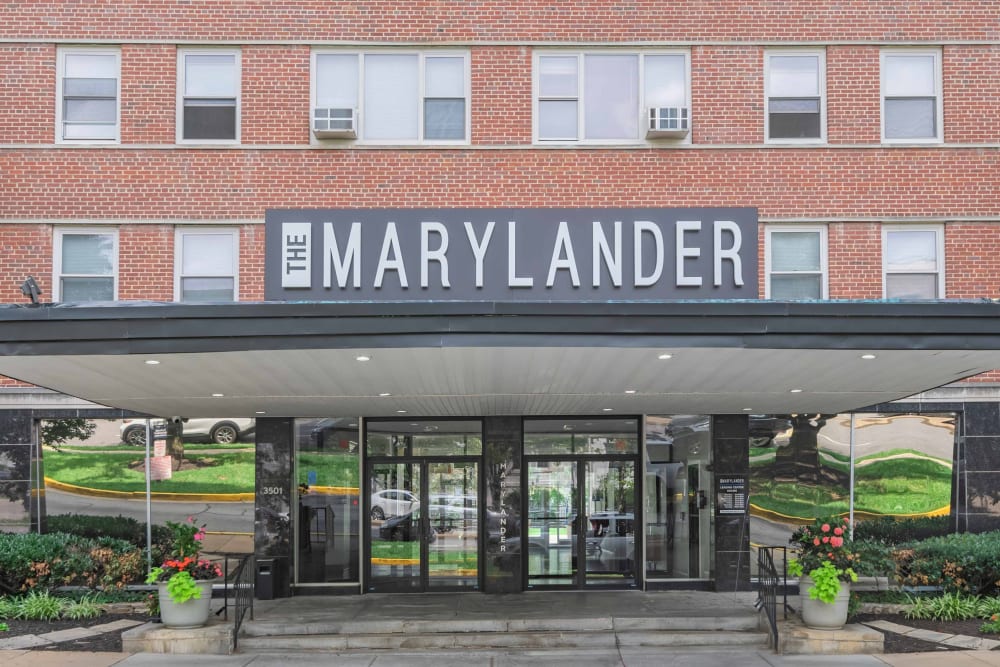 Building exterior with meticulous landscaping at The Marylander Apartment Homes in Baltimore, Maryland