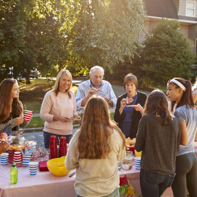 Residents gathering during a neighborhood event at Cascade Village in Joint Base Lewis-McChord, Washington