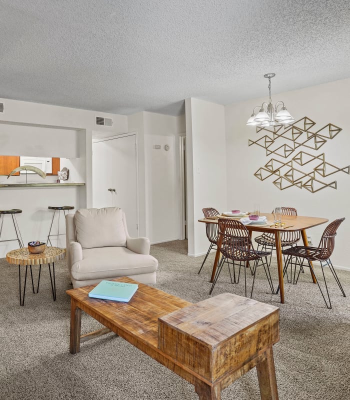 Dining room and living room at The Chimneys Apartments in El Paso, Texas