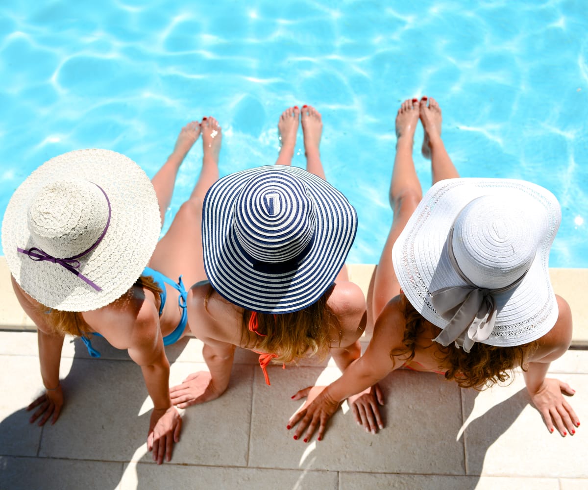 Friends enjoying the pool at Newport Apartments in Amarillo, Texas