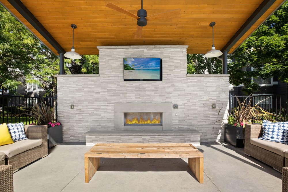 Covered lounge at the fire pit area at Centro Apartment Homes in Hillsboro, Oregon