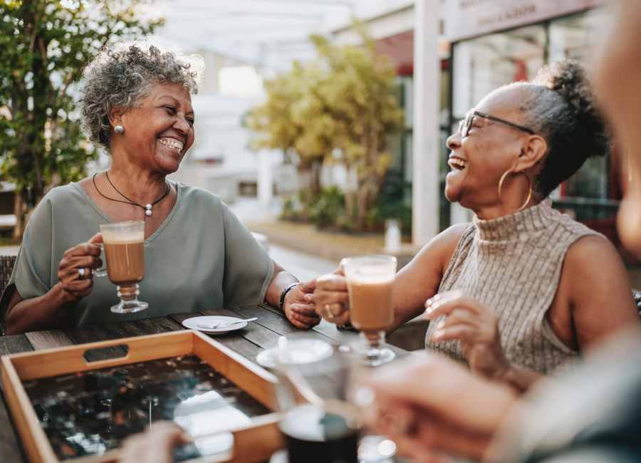 Residents smiling near The Residences at Thomas Circle in Washington, District of Columbia