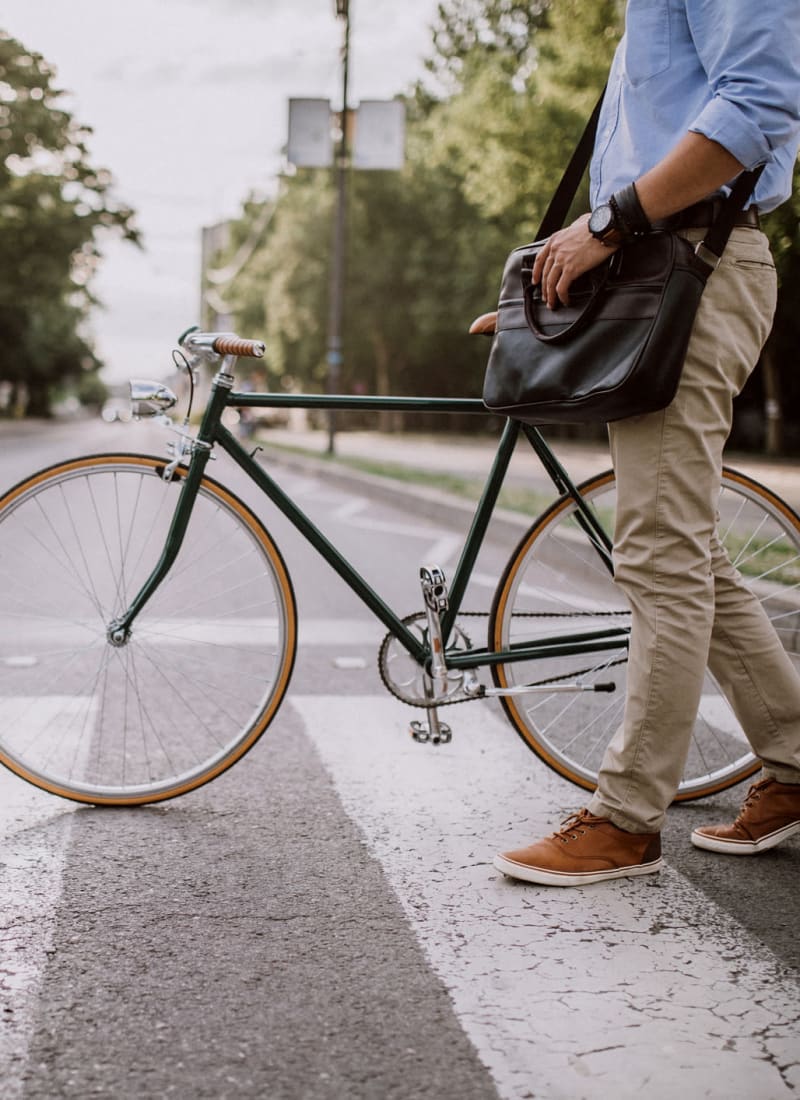 Resident walking his bike near Marquis at Canyon Ridge in Austin, Texas
