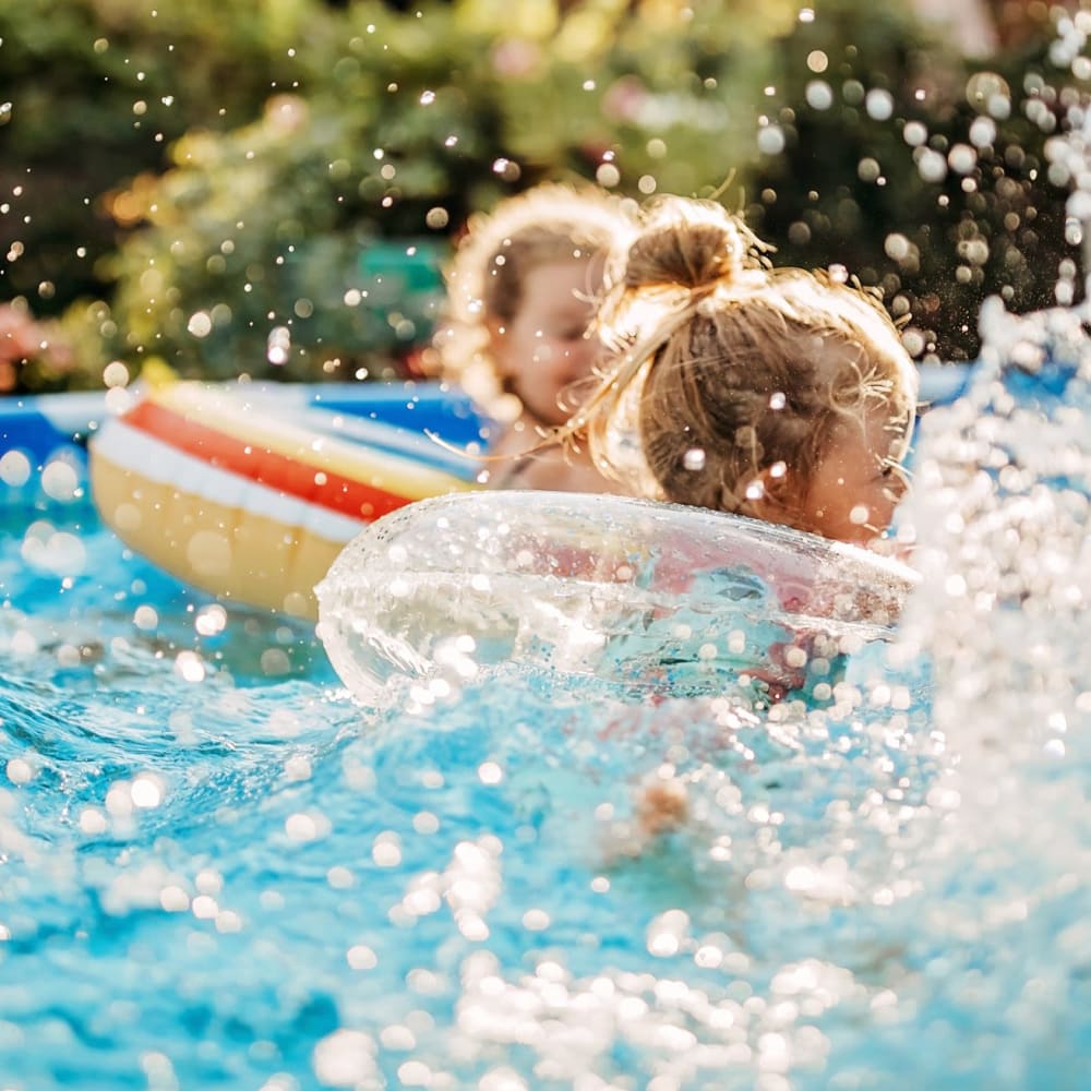 Kids splashing in a pool at The Legends on the Park in Eureka, Missouri