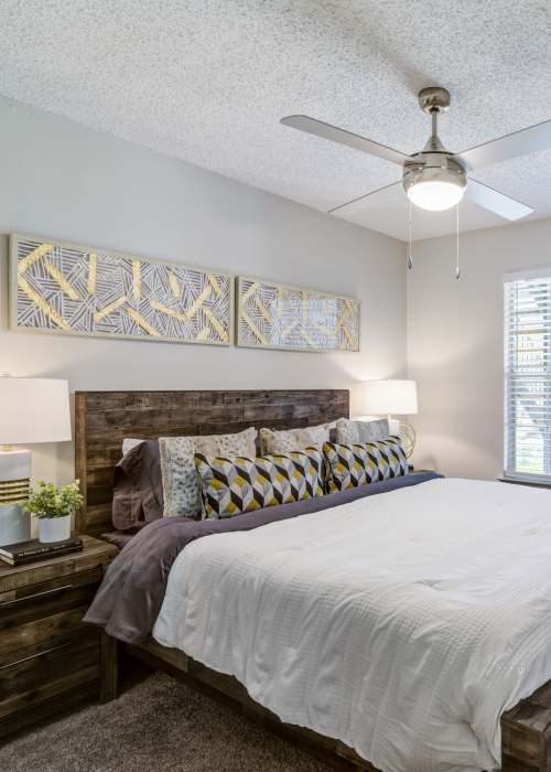Bedroom with ceiling fan at Belmont Estates in Arlington, Texas