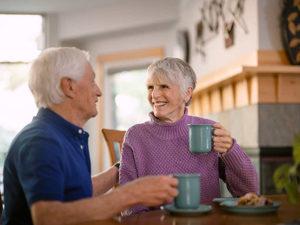 A couple enjoying coffee together at Touchmark on South Hill in Spokane, Washington