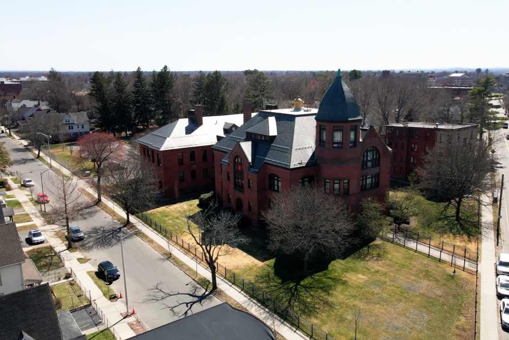 Historic red brick architecture with spires near Bh Tapley Court in Springfield, Massachusetts