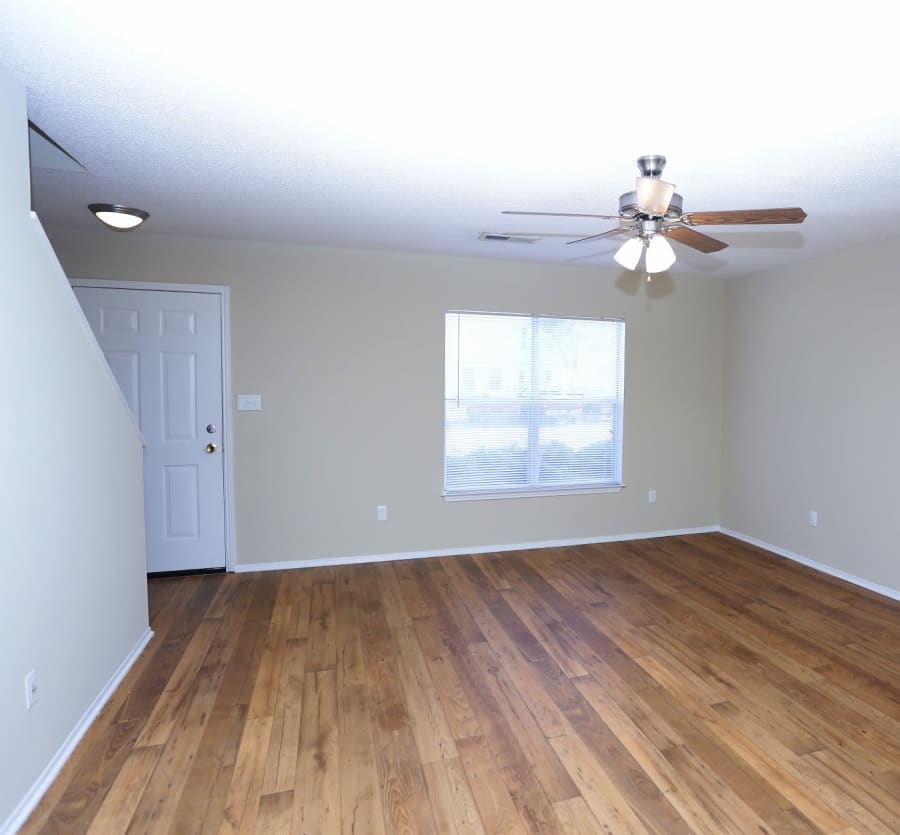 Living room with hardwood vinyl at Madison Pines Apartment Homes in Madison, Alabama