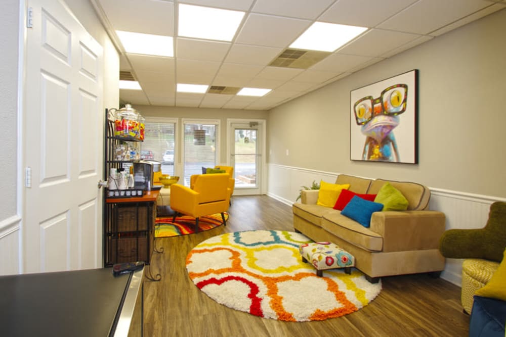 Community clubhouse with comfortable couches at Old Mill Townhomes in Lynchburg, Virginia