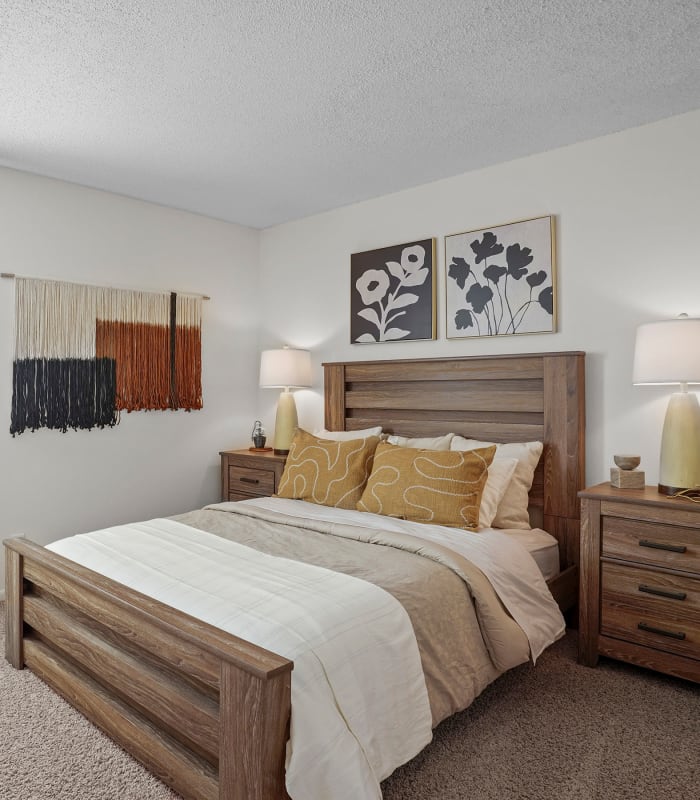 The Spacious carpeted bedroom at The Greens of Bedford in Tulsa, Oklahoma
