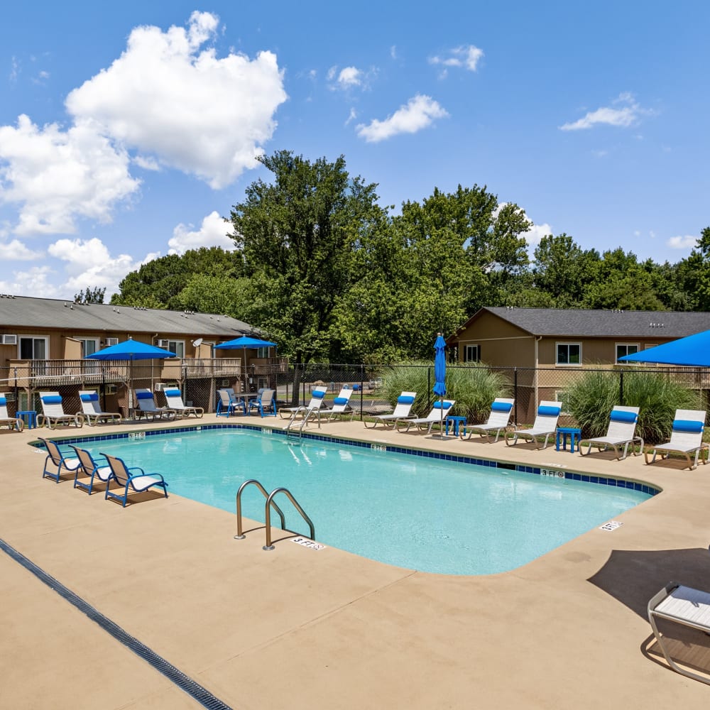 Swimming pool surrounded by lounge chairs at 1022 West Apartment Homes in Gaffney, South Carolina