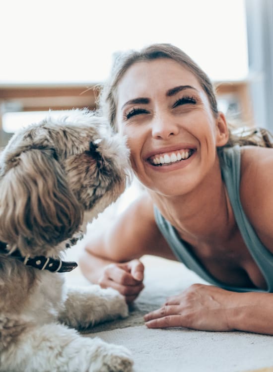 Resident with her dog at Solaire 7077 Woodmont in Bethesda, Maryland