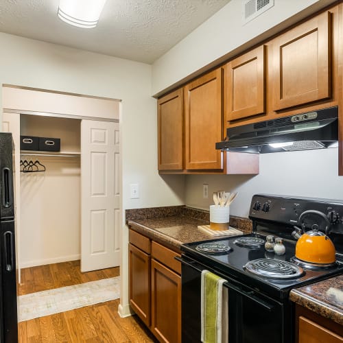 Kitchen with modern lighting and counter seating at Lakeside Landing Apartments in Lakeside Park, Kentucky