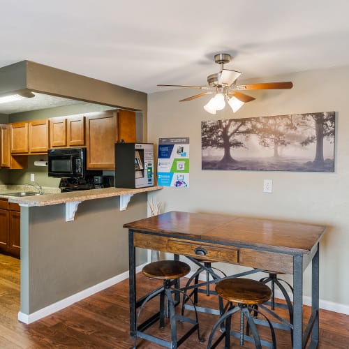 Fully-equipped kitchen and dining area at Monroe Terrace Apartments in Monroe, Ohio