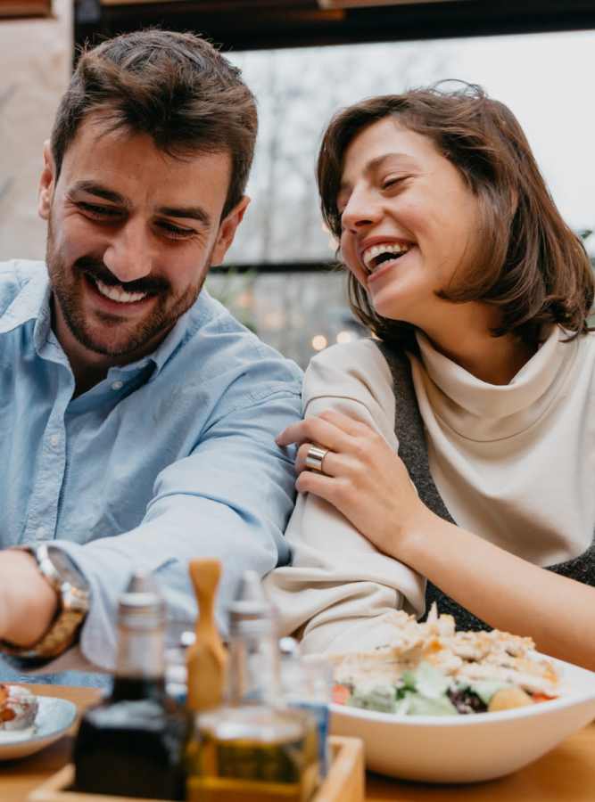 Couple laughing at the dinner table at Live Jacksonville FL in Jacksonville, Florida