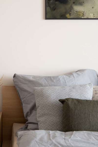 Cozy bedroom with wall art at The Springs at Georgetown in Georgetown, Texas 