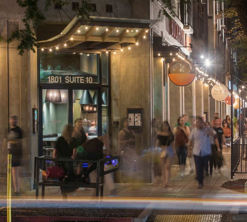 Bustling street outside of 1801L Apartments in Sacramento, California