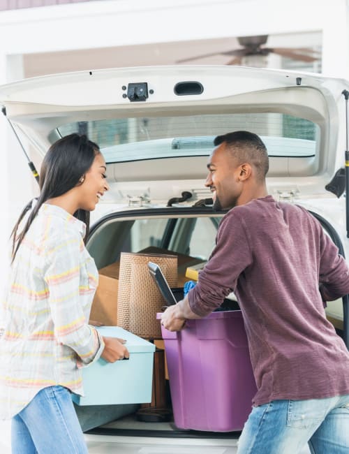 A couple packs belongings into their car, en route to Storage World in Sinking Spring, Pennsylvania