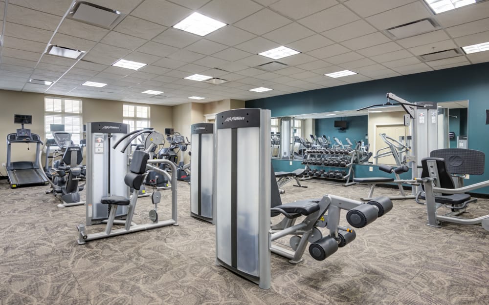 Well-equipped fitness center with cardio equipment at Gateway Landing on the Canal in Rochester, New York