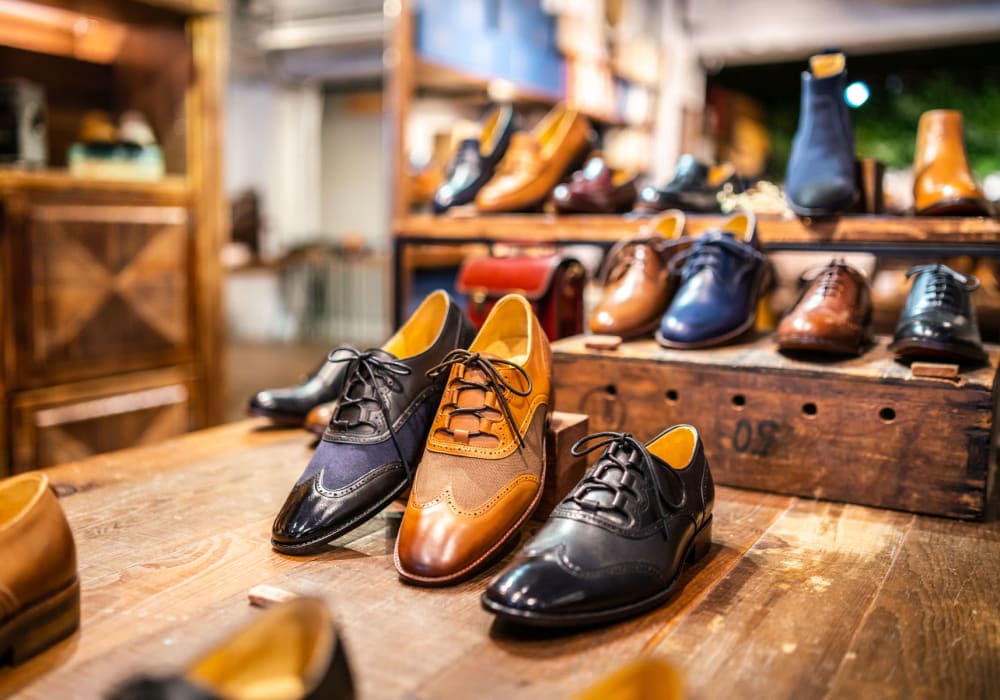 Men's shoes on display at a downtown retail shop near Village Pointe in Northridge, California