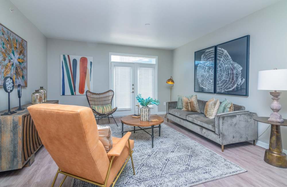Living room with many seating options at Cleo Luxury Apartments in Dallas, Texas