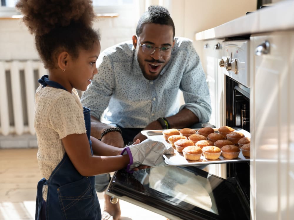 Resident helping his daughter bake cookies at Montecito Apartments in Santa Clara, California