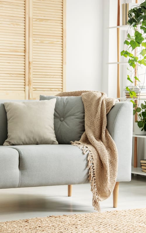 Cozy couch in a decorated home at Mayfair Reserve in Wauwatosa, Wisconsin