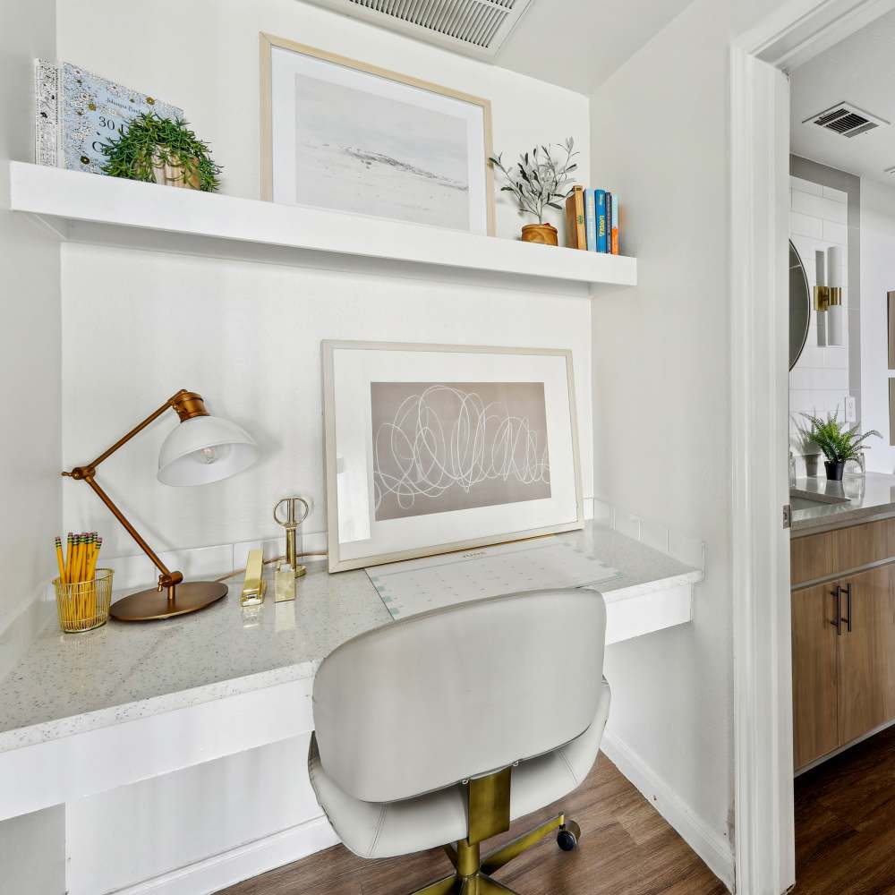 Stylish desk with chair and wall shelves at Sutton in Austin, Texas