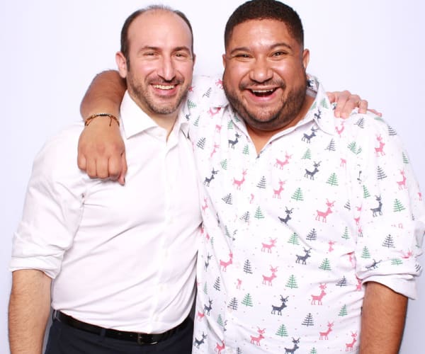 Employees posing in the photo booth at an event at Campus Life & Style in Austin, Texas