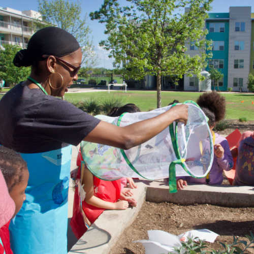 Kids playing outside at Shadow Brook Apartments in Arlington, Texas