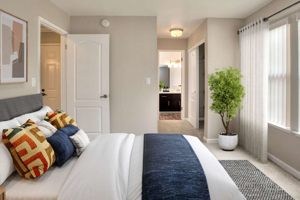 Bedroom and ensuite bathroom at Seventeen Mile Drive Village Apartment Homes in Pacific Grove, California