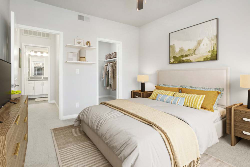 Spacious bedroom with a walk-in closet at Alicante Apartment Homes in Aliso Viejo, California