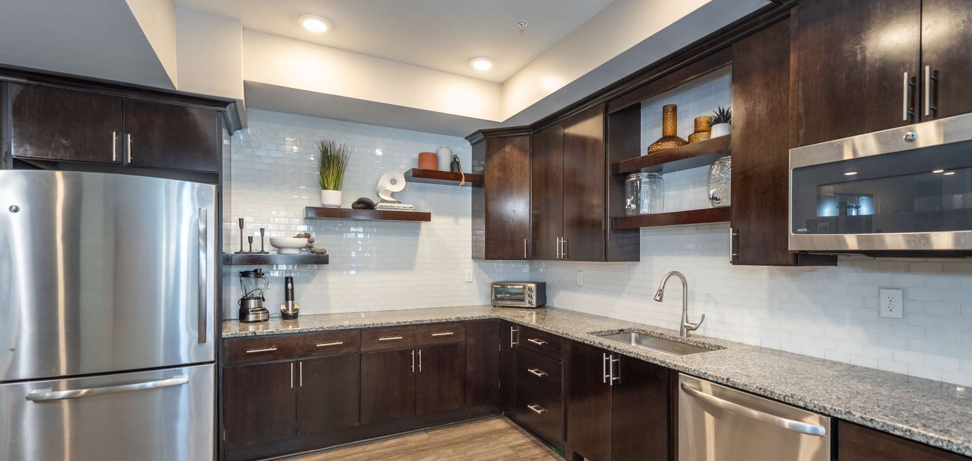 Kitchen with stainless steel appliances at CovePointe at The Landings, Norfolk, Virginia