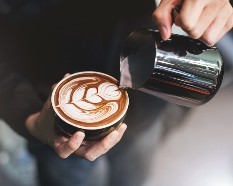 Barista making a latté for a customer near Sofi Union City in Union City, California