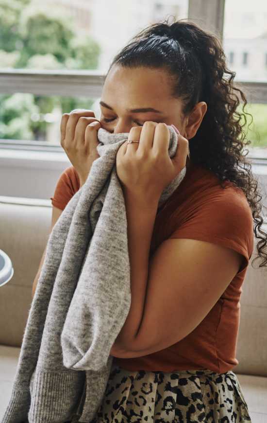 Student doing laundry at one of the clothes care centers at Rendezvous in Edmond, Oklahoma