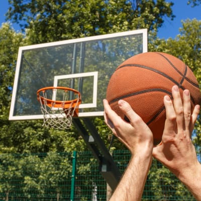 A resident playing basketball at Bayview Hills in San Diego, California