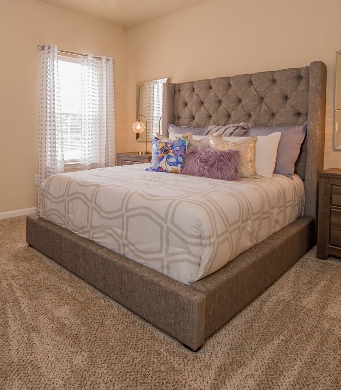 Chic bedroom with ceiling fan at Lexington Park Apartment Homes in North Little Rock, Arkansas