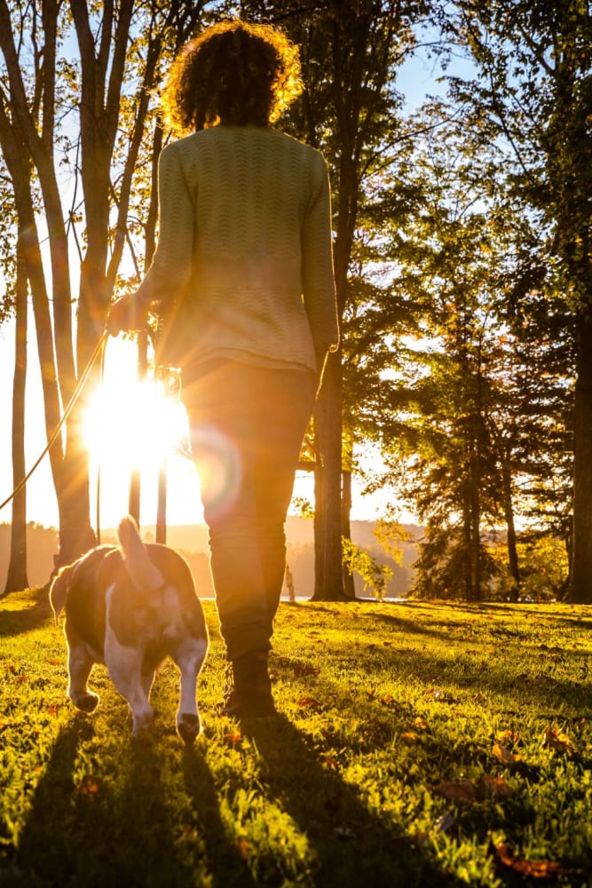 Resident on a walk with her dog near Audubon Village in Bridge City, Louisiana