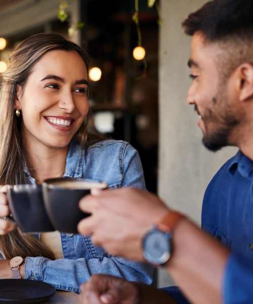 Couple having coffee at a cafe nearby 1729 Midtown in Lexington, Kentucky