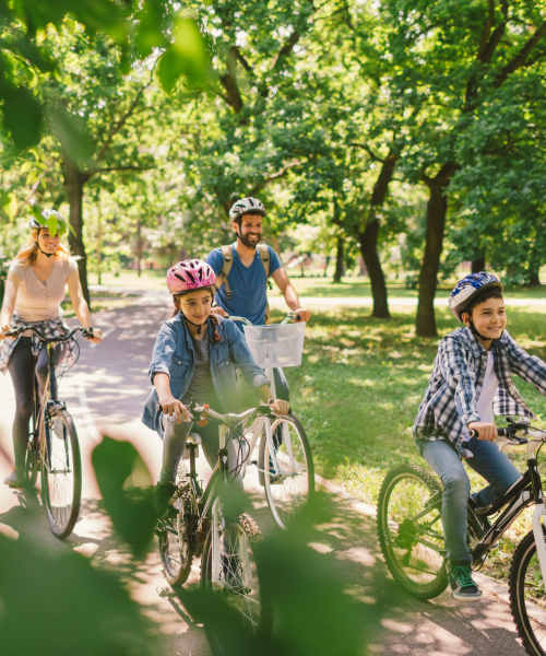 Resident family riding bicycles in the park near 511 Queens in Charlotte, North Carolina