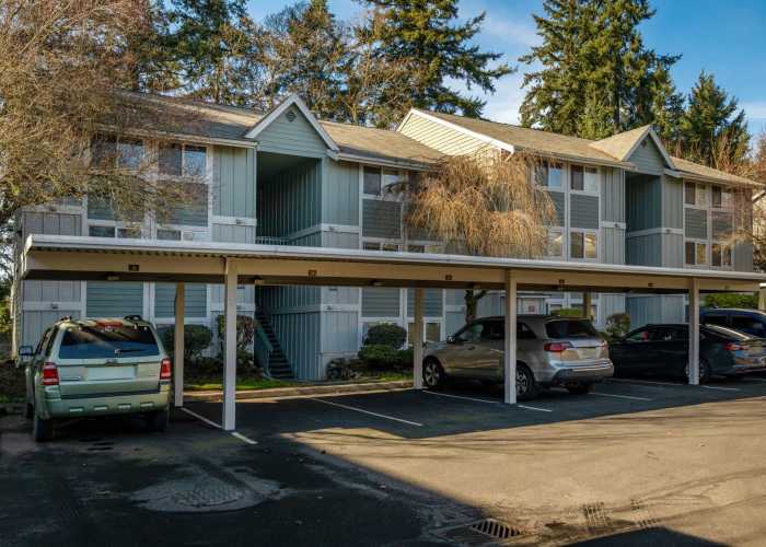 Modern kitchen with white wood cabinet and steel appliances at Briarstone in Tacoma, Washington
