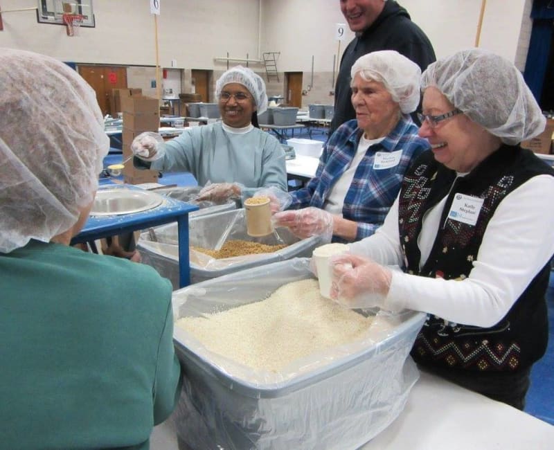 Residents from Meadows on Fairview helping at a homeless shelter in Wyoming, Minnesota