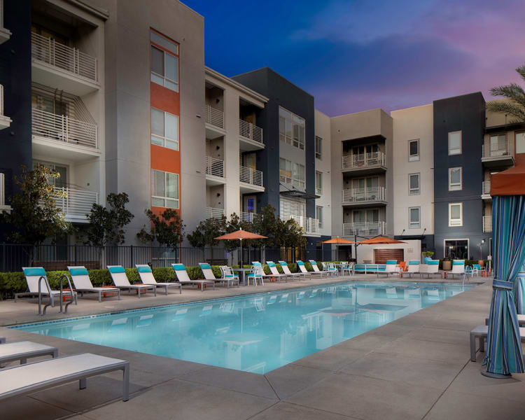 Swimming pool area at dusk at Sofi Warner Center in Woodland Hills, California